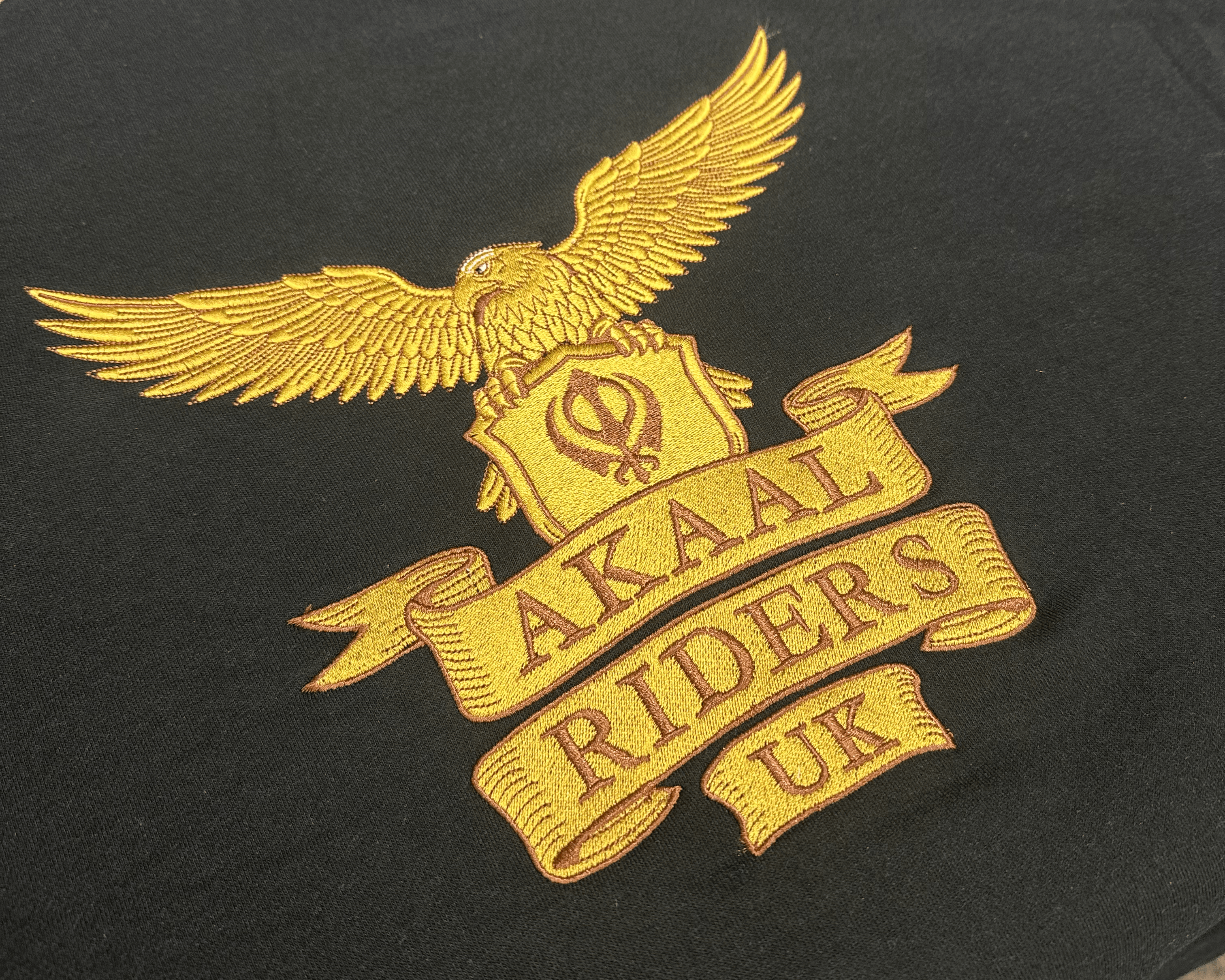 Custom embroidered workwear that has been done on a jumper used as part of a uniform. 