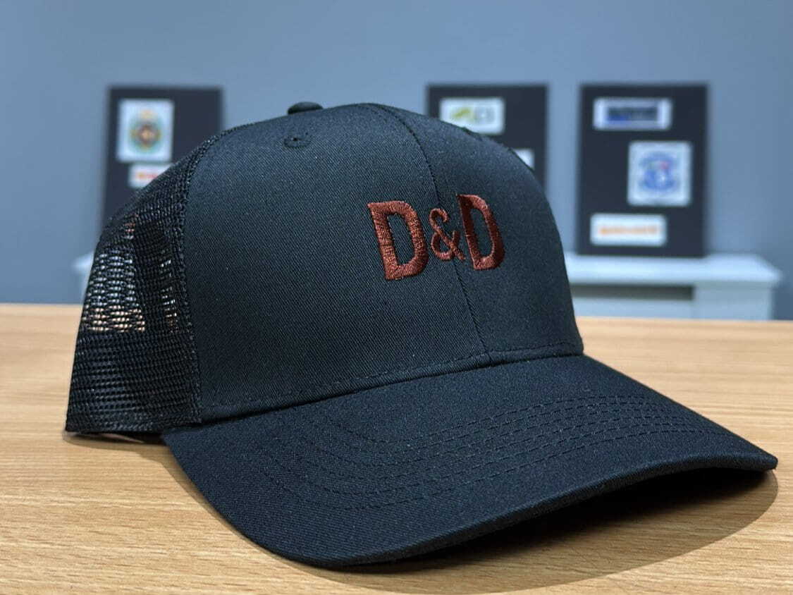 A cap embroidered with the logo to match the embroidery on the uniform. 